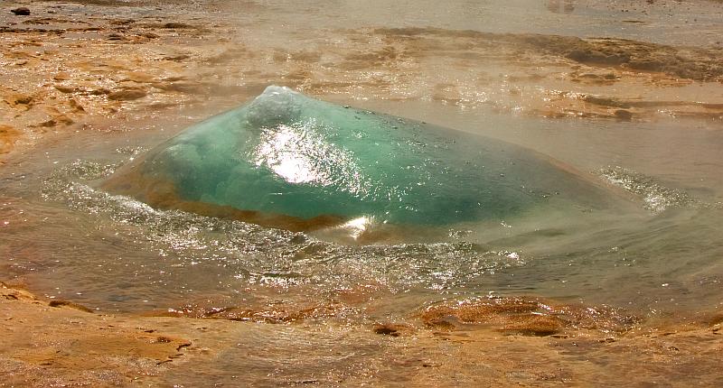 Water bulge of erupting geyser