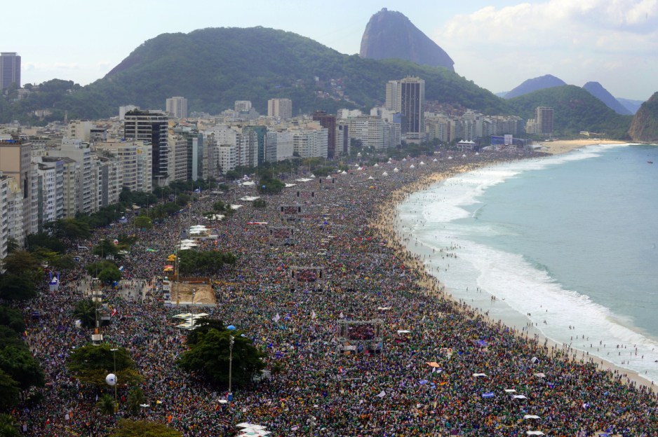 Hundreds of thousands of people crowd Copacabana beach in Rio de Janeiro on July 28, 2013 as Pope Francis celebrates the final mass of his visit to Brazil. Throngs of pilgrims attending World Youth Day (WYD) spent the night sleeping on the beach before Sunday's final mass, while the city's mayor said he expects up to three million people to pack the beach for the occasion.   AFP PHOTO / TASSO MARCELO        (Photo credit should read TASSO MARCELO/AFP/Getty Images)