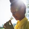 Woman Smelling a Flower - Sense of Smell